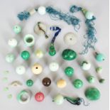 A GOOD ASSORTMENT OF 19TH/20TH CENTURY CHINESE JADE & HARDSTONE BEADS AND PENDANTS ETC, the beads of