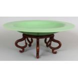 A LARGE 19TH/20TH CENTURY CHINESE LIME GREEN BEIJING GLASS DISH, with fitted carved hardwood