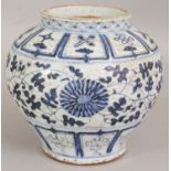 A CHINESE YUAN STYLE BLUE & WHITE PORCELAIN JAR, the sides decorated with formal scrolling