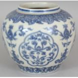 A CHINESE MING STYLE BLUE & WHITE PORCELAIN JAR, decorated with formal foliage and ruyi form panels,
