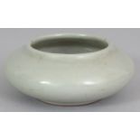 A CHINESE CELADON PORCELAIN BRUSHWASHER, the base with a Qianlong seal mark, 3.5in wide.