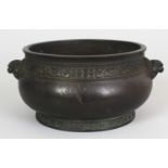 A CHINESE BRONZE BOMBE CENSER, weighing 1.56Kg, the sides cast with narrow bands of archaic