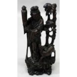 A LARGE 19TH/20TH CENTURY CHINESE SILVER-WIRE INLAID CARVED HARDWOOD FIGURE OF AN IMMORTAL, in the