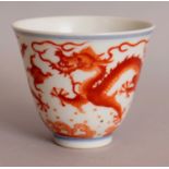 A CHINESE ROUGE-DE-FER PORCELAIN DRAGON WINE CUP, decorated with dragons pursuing flaming pearls
