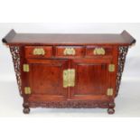 A GOOD CHINESE HARDWOOD ALTER TABLE, with three drawers above a pair of cupboard doors and with