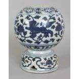 A CHINESE MING STYLE BLUE & WHITE PORCELAIN TULIP VASE, the unusual spherical body supported on a