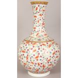 A LARGE CHINESE FAMILLE ROSE PORCELAIN BOTTLE VASE, decorated with a design of bats amidst cloud