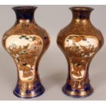 A PAIR OF SIGNED JAPANESE MEIJI PERIOD SATSUMA EARTHENWARE VASES, each painted with various panels