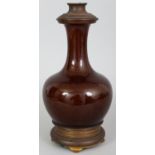 A CHINESE BROWN GLAZED PORCELAIN BOTTLE VASE, fitted as a lamp with late 19th Century French metal