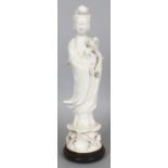 A 20TH CENTURY CHINESE BLANC-DE-CHINE PORCELAIN FIGURE OF GUANYIN, together with a fitted wood