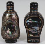 TWO CHINESE LAC BURGUATE SNUFF BOTTLES, with stoppers, each decorated with river landscape panels,