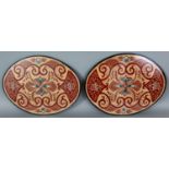 A PAIR OF 20TH CENTURY CHINESE FRAMED OVAL EMBROIDERIES, mainly worked in gilt thread, 17.8in x 13.