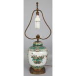 A 19TH CENTURY CHINESE FAMILLE VERTE PORCELAIN JAR & COVER, fitted for electricity with ormolu style