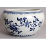 A CHINESE UNDERGLAZE-BLUE & COPPER-RED PORCELAIN JARDINIERE, the sides decorated with extended