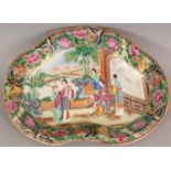 A 19TH CENTURY CHINESE RUYI FORM CANTON MANDARIN PORCELAIN DISH, the interior well painted in