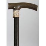 ANOTHER RHINOCEROS HORN HANDLED WOOD WALKING STICK, with a hallmarked silver collar bearing a