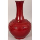 A 19TH/20TH CENTURY CHINESE FLAMBE GLAZED PORCELAIN BOTTLE VASE, with ribbed shoulders, the sides