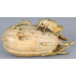 A GOOD JAPANESE MEIJI PERIOD STAINED IVORY OKIMONO, unsigned, carved in the form of a locust and