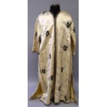 A NEAR EASTERN EMBROIDERED CREAM GROUND SILK ROBE, approx. 58in high from hem to collar.