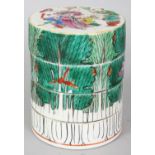 A 19TH CENTURY CHINESE FOUR SECTION CANTON FAMILLE ROSE STACKED CIRCULAR BOX, the cover painted with