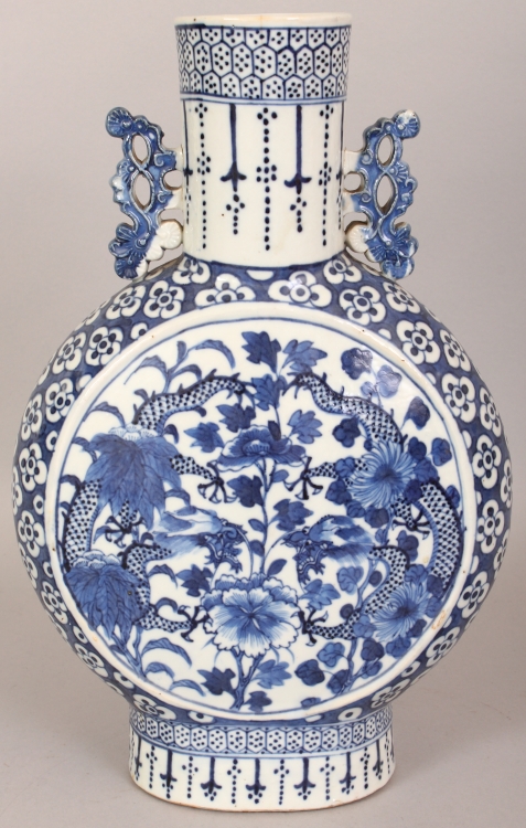 A 19TH CENTURY CHINESE BLUE & WHITE PORCELAIN MOON FLASK, each side painted with a circular panel of