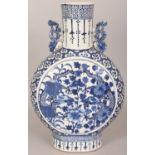 A 19TH CENTURY CHINESE BLUE & WHITE PORCELAIN MOON FLASK, each side painted with a circular panel of