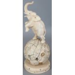 A GOOD QUALITY JAPANESE MEIJI PERIOD IVORY & MOTHER-OF-PEARL OKIMONO OF A REARING ELEPHANT,