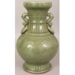 A GOOD CHINESE LONGQUAN CELADON VASE, decorated beneath the glaze with scrolling lotus between