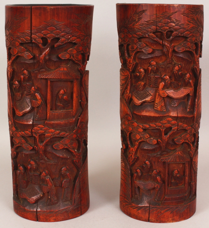 A LARGE PAIR OF EARLY 20TH CENTURY CHINESE CARVED BAMBOO CYLINDRICAL BRUSH POTS, each decorated with