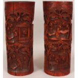 A LARGE PAIR OF EARLY 20TH CENTURY CHINESE CARVED BAMBOO CYLINDRICAL BRUSH POTS, each decorated with