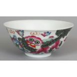 A 19TH/20TH CENTURY CHINESE FAMILLE ROSE PORCELAIN BOWL, the sides painted with Buddhistic lions and