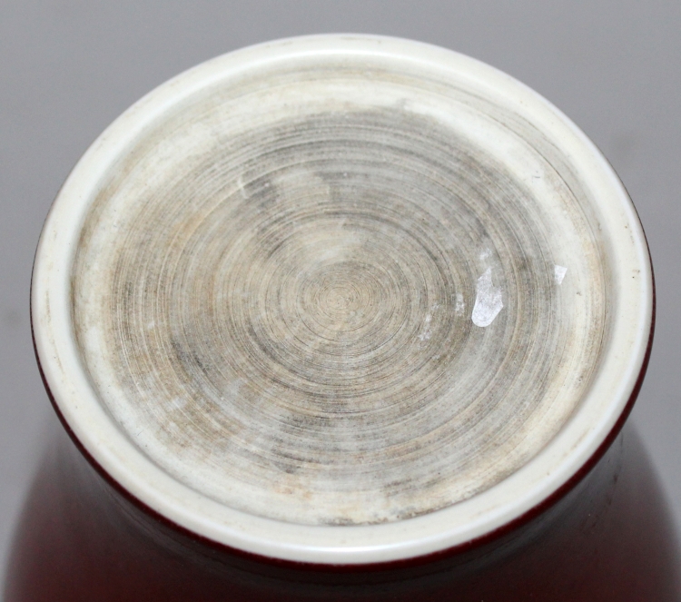 A CHINESE SANG-DE-BOEUF PORCELAIN VASE, the glaze slightly mottled, the base unglazed, 7.5in high. - Image 4 of 4