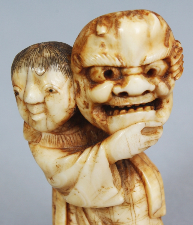 A JAPANESE MEIJI PERIOD IVORY NETSUKE OF A STANDING BOY, unsigned, the boy bearing aloft a Noh mask, - Image 5 of 7