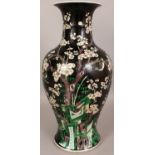 A GOOD LARGE 19TH CENTURY CHINESE FAMILLE NOIRE PORCELAIN VASE, the sides painted with birds