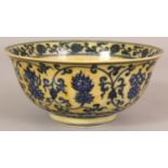 A CHINESE MING STYLE YELLOW GROUND PORCELAIN BOWL, the interior with Tibetan characters, the sides