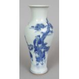 A CHINESE BLUE & WHITE PORCELAIN BALUSTER VASE, decorated with a figural fenced garden scene, the