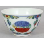 A CHINESE DOUCAI PORCELAIN TEA BOWL, the sides decorated with hanging vine, the base with a six-