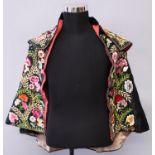 A NEAR EASTERN EMBROIDERED SILK CAPE, approx. 30in high from hem to collar.