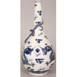 A CHINESE BLUE & WHITE PORCELAIN DRAGON BOTTLE VASE, the base with a six-character Kangxi mark, 9.