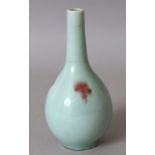 A 19TH CENTURY CHINESE JUNYAO STYLE PORCELAIN BOTTLE VASE, the sides with copper-red splashes over a
