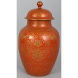 A GOOD QUALITY CHINESE CORAL GROUND PORCELAIN VASE & COVER, the sides decorated with formal