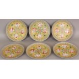 A SET OF SIX GUANGXU MARK & PERIOD YELLOW GROUND FAMILLE ROSE PORCELAIN PLATES, each painted to
