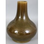 A CHINESE TEA DUST PORCELAIN BOTTLE VASE, applied with a streaked and slightly iridescent glaze, 8.