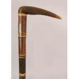 A GOOD RHINOCEROS HORN WALKING STICK, with rhino handle and rhino stick sections, the sections