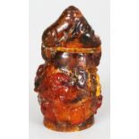A 19TH/20TH CENTURY CHINESE AMBER SNUFF BOTTLE & STOPPER, weighing 29.5gm, the sides carved in