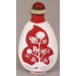 AN UNUSUAL CHINESE WHITE OVERLAY GLASS SNUFF BOTTLE & STOPPER, the pear form body decorated with two