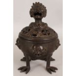 AN UNUSUAL CHINESE BRONZE CENSER & COVER, weighing 4.66Kg, the sides cast with masks and Shou