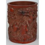 A 19TH CENTURY CHINESE BAMBOO BRUSH POT, the sides carved in high relief with a continuous scene