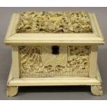 A GOOD 19TH CENTURY CHINESE CANTON IVORY CASKET, with a hinged cover and interior fitted tray, the