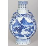 A 19TH CENTURY CHINESE BLUE & WHITE PORCELAIN MOON FLASK, each side painted with a circular